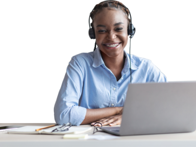 person-blue-shirt-laptop Person in a blue shirt smiling in front of a laptop