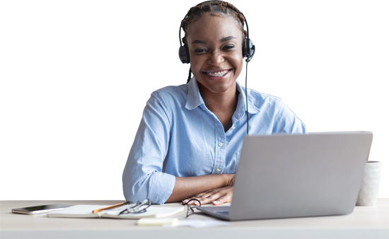 Person with headphones on smiling at the camera